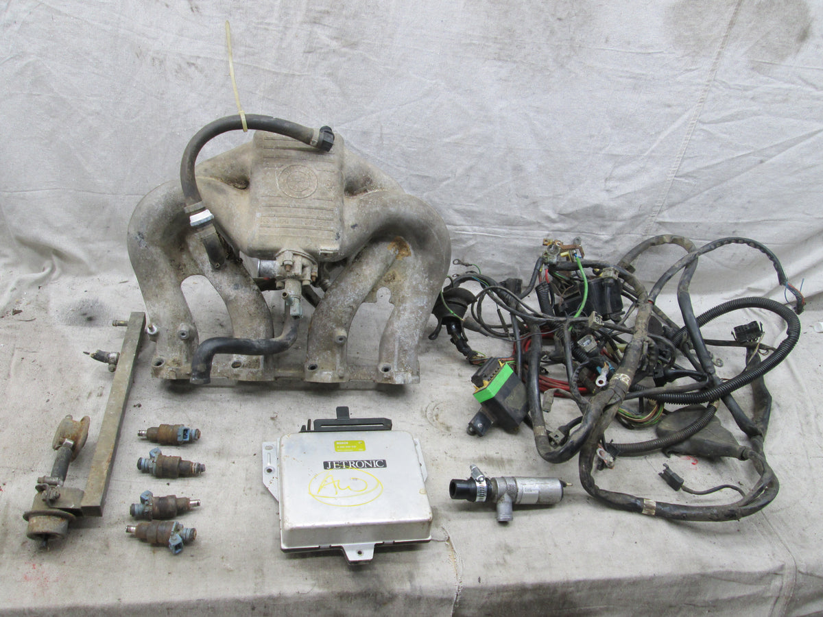 BMW E30 318i M10 2002 swap EFI intake manifold injectors throttle body Allums Imports